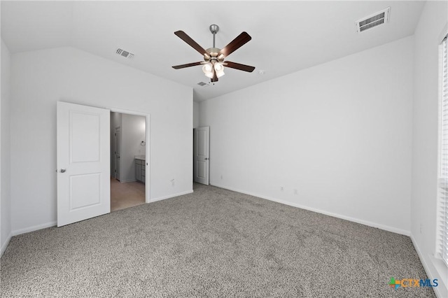 unfurnished bedroom featuring ceiling fan, carpet floors, and vaulted ceiling