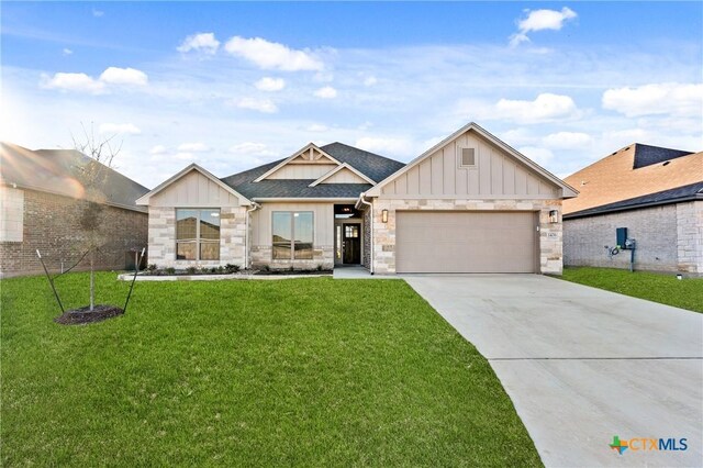 craftsman-style house featuring a front yard and a garage