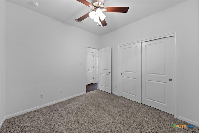 unfurnished bedroom featuring ceiling fan, carpet floors, and a closet