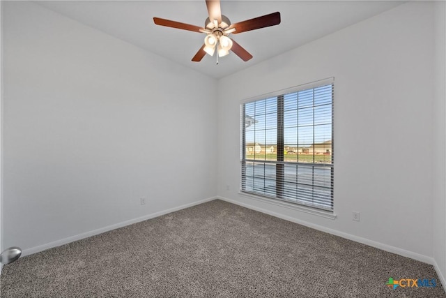 spare room with ceiling fan and carpet floors