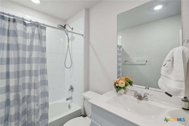 full bathroom with shower / bath combination with curtain, toilet, and vanity