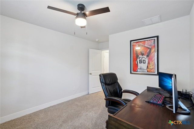 carpeted office with ceiling fan