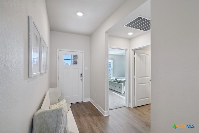 foyer entrance with light wood-type flooring