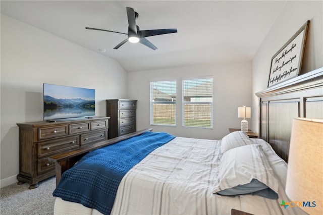 carpeted bedroom featuring ceiling fan and lofted ceiling