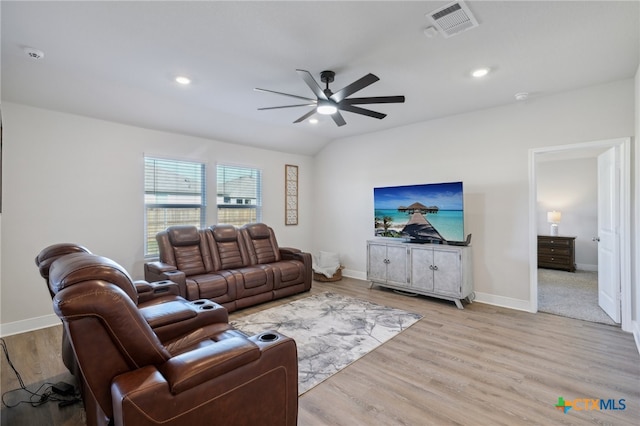 living room with ceiling fan and light hardwood / wood-style flooring