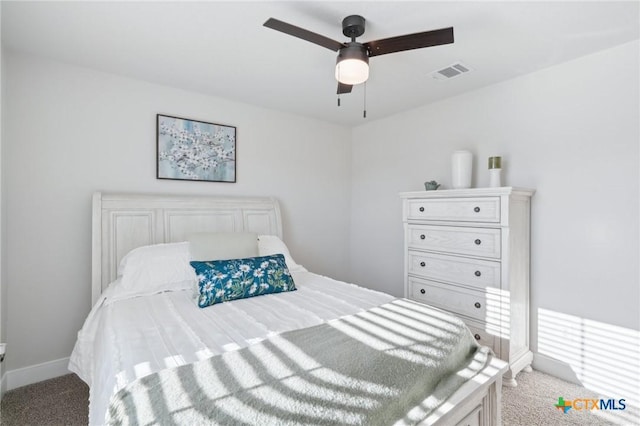 bedroom featuring ceiling fan and light carpet