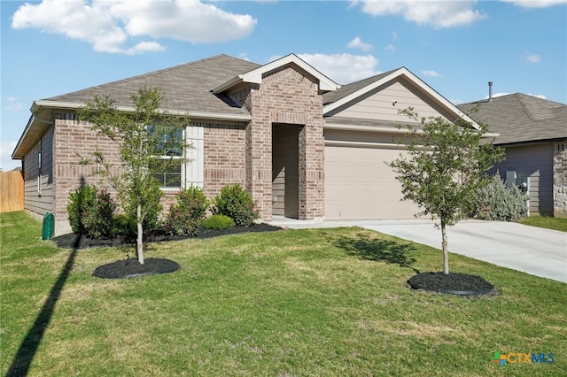 view of front of house featuring a garage and a front yard