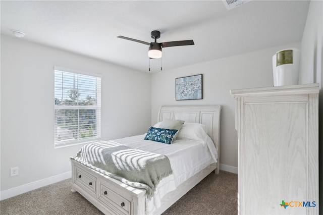 bedroom with ceiling fan and light colored carpet