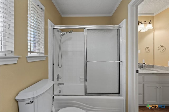 full bathroom with shower / bath combination with glass door, vanity, toilet, and crown molding