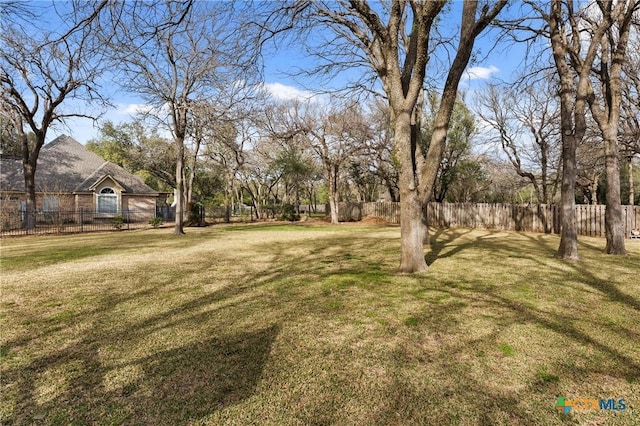 view of yard featuring fence