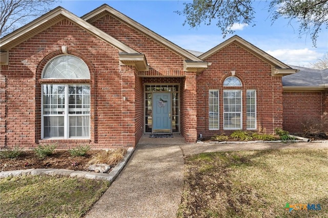 view of front of property featuring brick siding