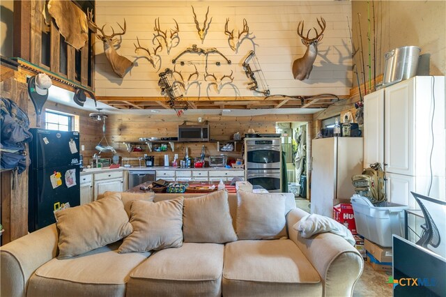 living room with wood walls