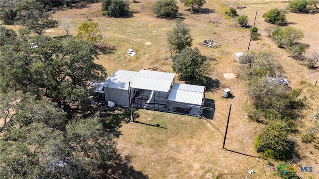 birds eye view of property with a rural view