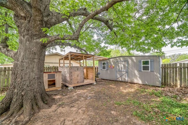801 E Johnson St, Burnet, TX 78611 - view of yard with an outdoor structure and fence