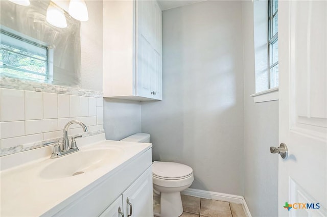801 E Johnson St, Burnet, TX 78611 - bathroom with plenty of natural light, toilet, vanity, and tile patterned flooring