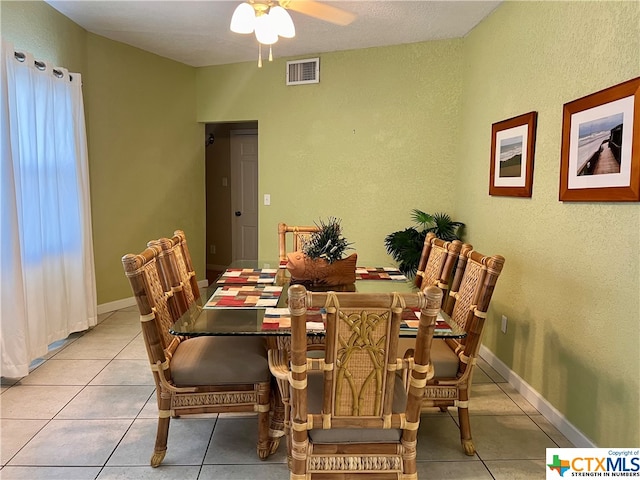 dining area featuring ceiling fan and light tile patterned floors