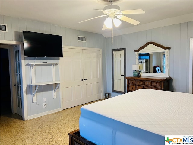 bedroom with ceiling fan and a closet