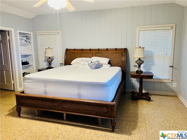 bedroom featuring ceiling fan and lofted ceiling