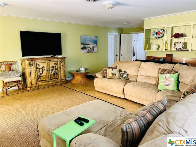 carpeted living room featuring crown molding