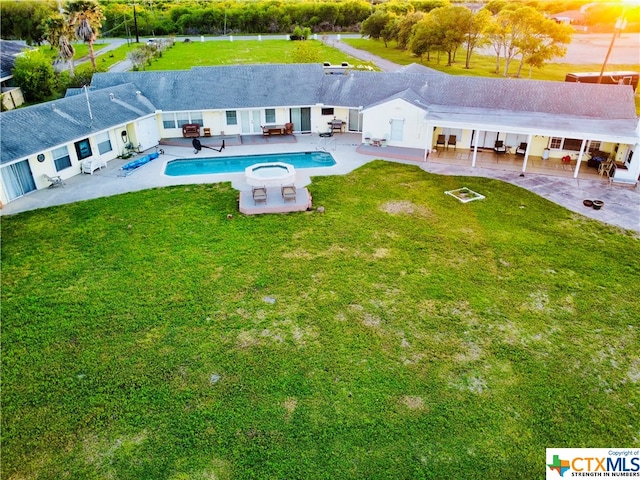 exterior space with a patio and a yard