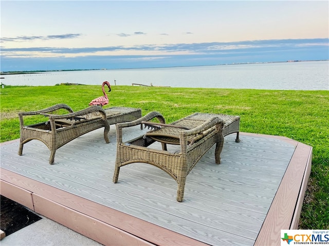 view of patio featuring a deck with water view