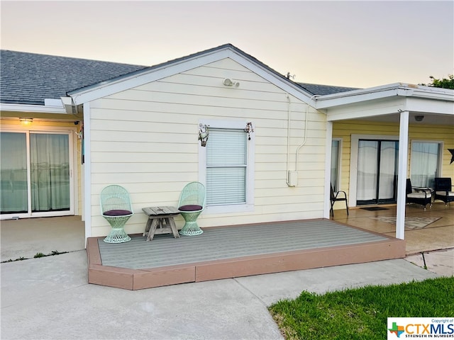 exterior space with a deck and a patio