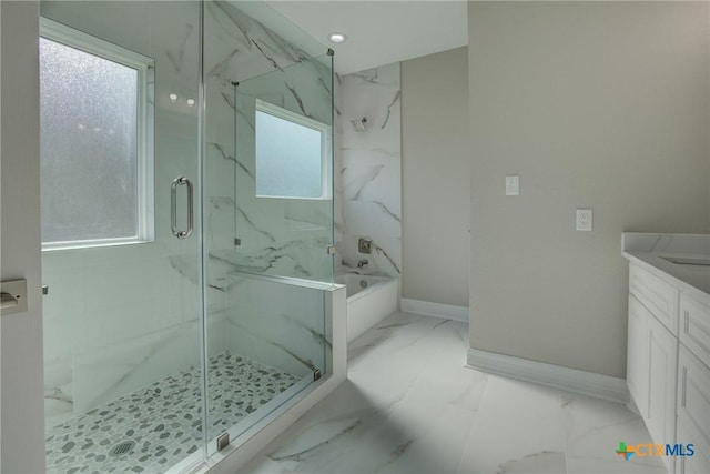 bathroom with vanity and independent shower and bath