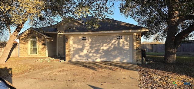 ranch-style house featuring a garage