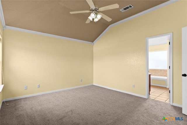 empty room with ceiling fan, lofted ceiling, and crown molding