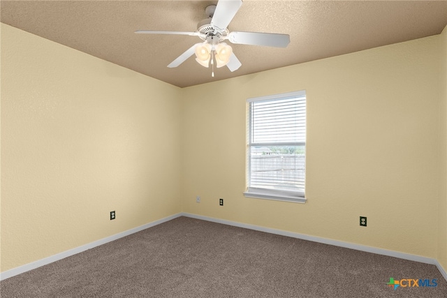 spare room with carpet flooring and ceiling fan