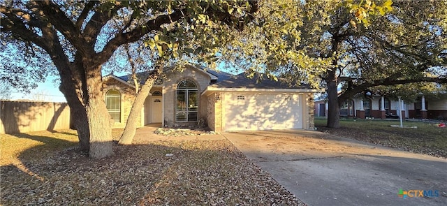 single story home with a garage