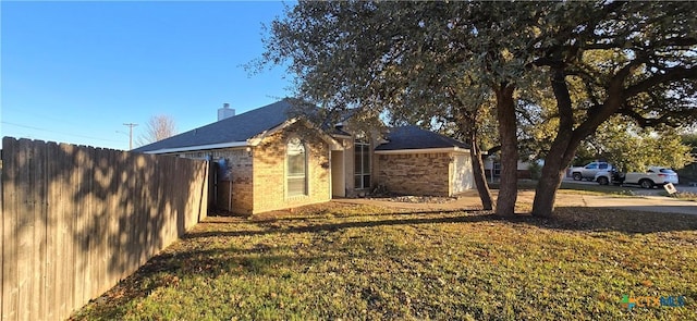 view of property exterior with a lawn