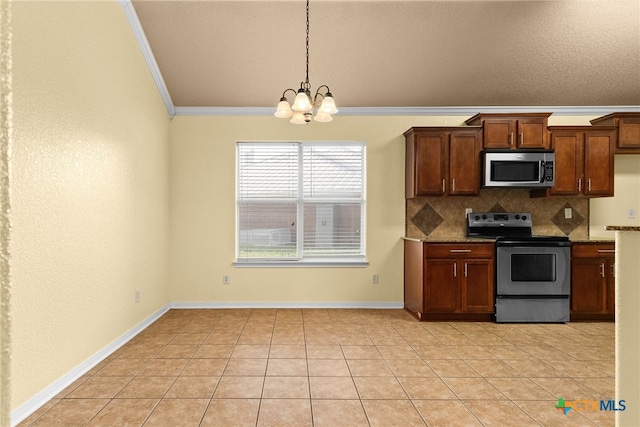 kitchen featuring crown molding, light tile patterned floors, stainless steel appliances, and a notable chandelier