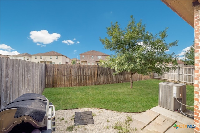 view of yard featuring a patio and central AC