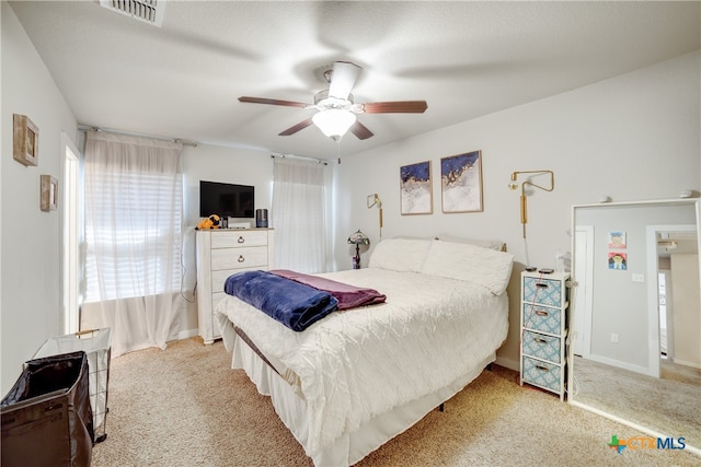 carpeted bedroom with ceiling fan