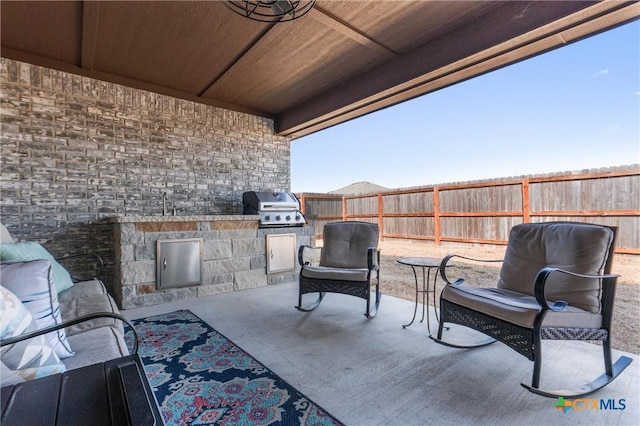 2446 Moreno Spur, Temple, TX 76501 - view of patio / terrace with fence, area for grilling, and exterior kitchen