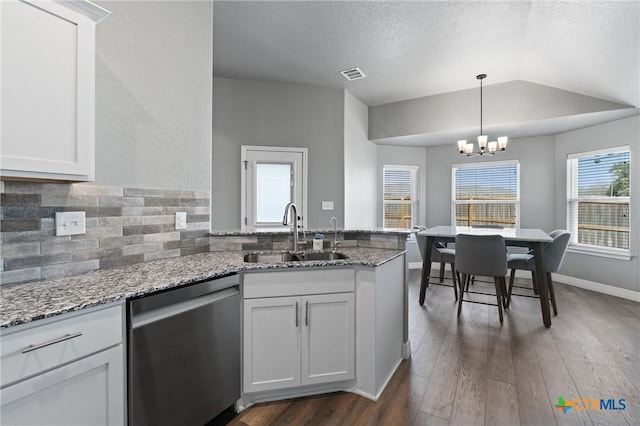 2446 Moreno Spur, Temple, TX 76501 - kitchen featuring a peninsula, dark wood-style floors, a sink, an inviting chandelier, and dishwasher