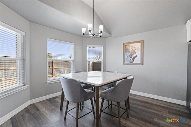 2446 Moreno Spur, Temple, TX 76501 - dining room with an inviting chandelier, lofted ceiling, dark wood finished floors, and baseboards