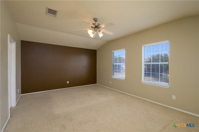 2109 Vernice Dr, Copperas Cove, TX 76522 - spare room featuring a ceiling fan, lofted ceiling, baseboards, visible vents, and light carpet