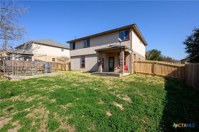 2109 Vernice Dr, Copperas Cove, TX 76522 - back of property with a patio area, a lawn, and a fenced backyard