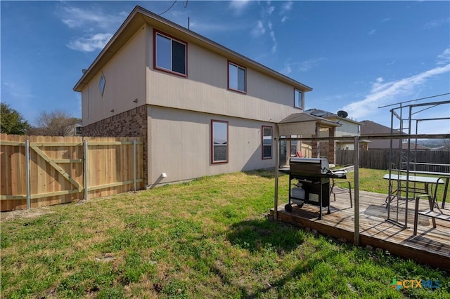 2109 Vernice Dr, Copperas Cove, TX 76522 - rear view of property featuring a fenced backyard, a wooden deck, and a lawn