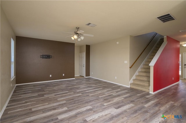 2109 Vernice Dr, Copperas Cove, TX 76522 - unfurnished room featuring visible vents, wood finished floors, a ceiling fan, and stairs