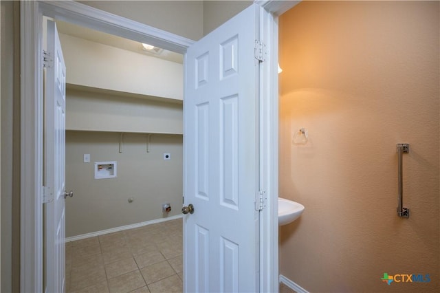 2109 Vernice Dr, Copperas Cove, TX 76522 - laundry room featuring light tile patterned flooring, washer hookup, hookup for a gas dryer, hookup for an electric dryer, and laundry area