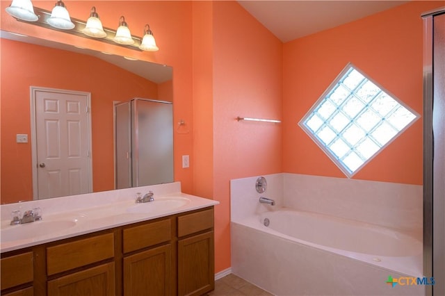 2109 Vernice Dr, Copperas Cove, TX 76522 - bathroom with a sink, double vanity, a garden tub, and a shower stall