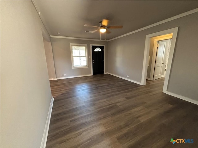 entrance foyer featuring dark wood-type flooring, ceiling fan, and ornamental molding