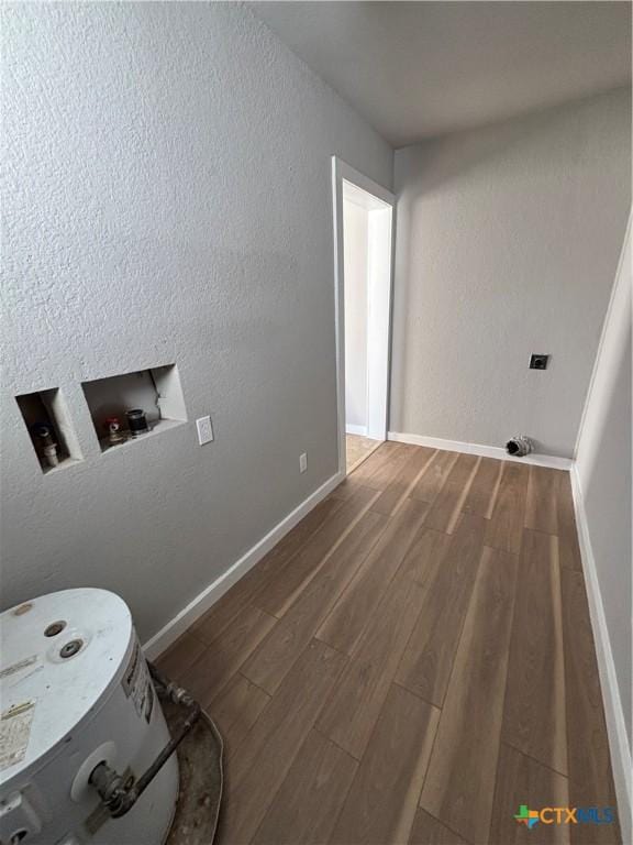 washroom with hookup for a washing machine and hardwood / wood-style flooring