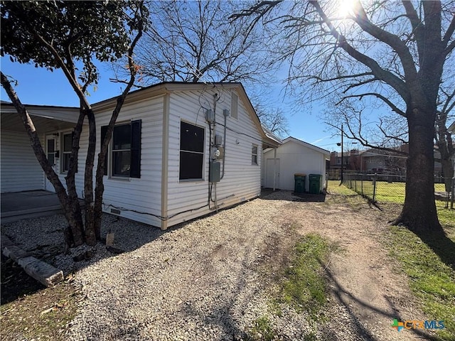 view of side of property with central AC unit