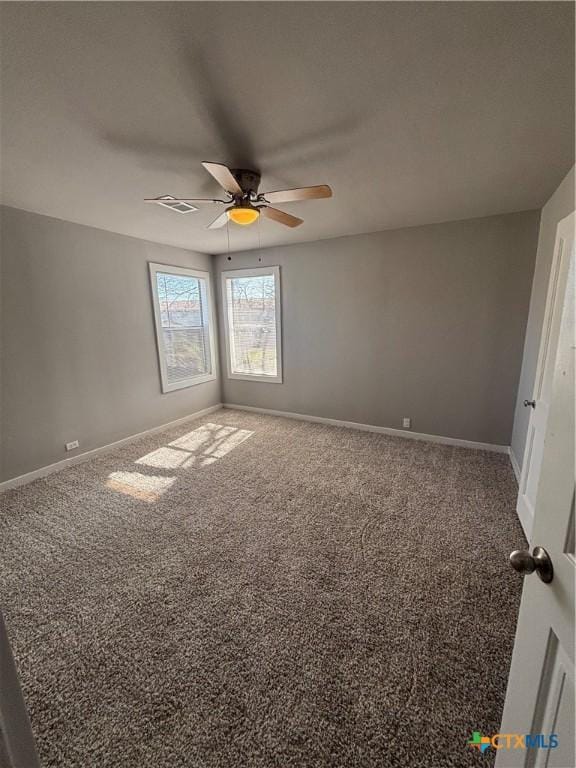 carpeted empty room featuring ceiling fan