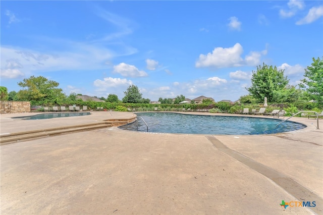 view of pool with a patio