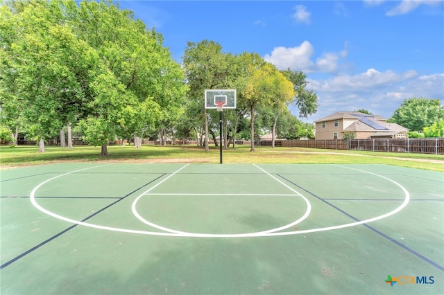 view of basketball court featuring a yard